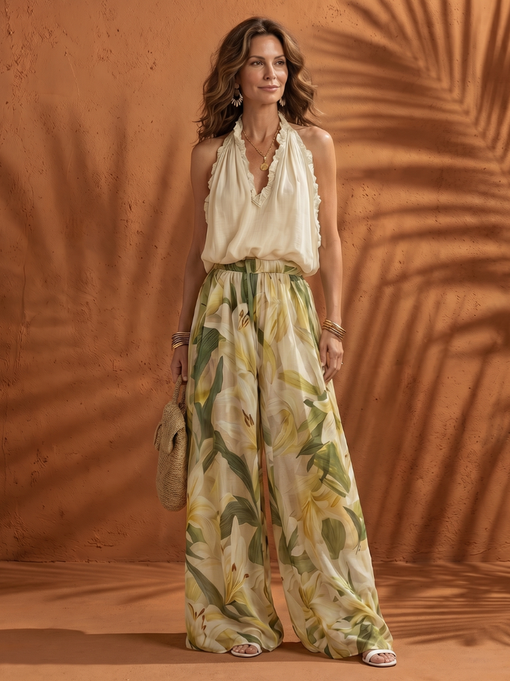 Solange | Souprava s halter halenkou a florálními širokými kalhotami