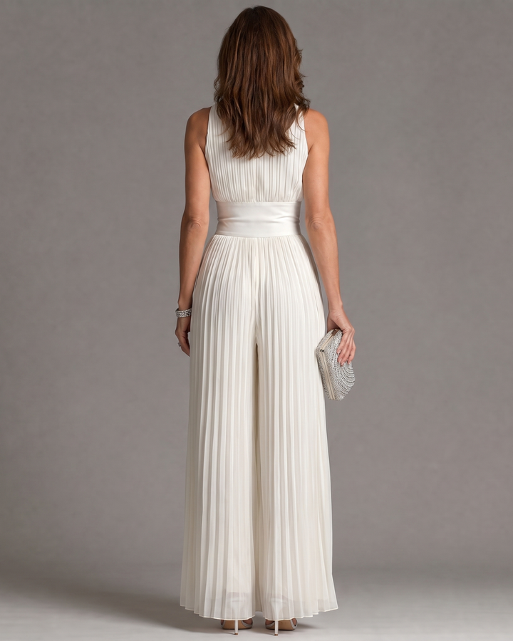 Zakira | Plisovaný overal s halter výstřihem a širokými nohavicemi